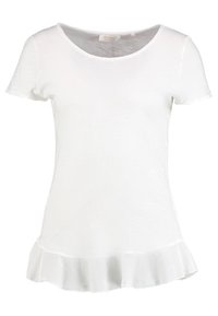 Camiseta blanca de manga corta con escote redondeado y dobladillo acampanado. Confeccionada en una tela ligera y ligeramente texturizada.