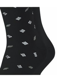 Schwarze Socken mit einem Muster aus weißen und grauen geometrischen Formen. Das Material ist weich und hat eine gerippte Textur. Geeignet für Freizeitkleidung.