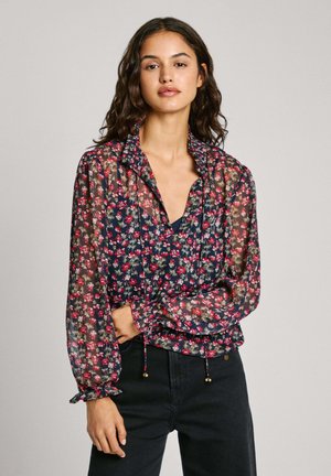 Blumenbluse mit einem marineblauen Hintergrund, transparenter Stoff, gerafftem Ausschnitt, elastischen Rüschem am Ärmel und Kordelzugdetails mit metallischen Akzenten.