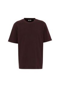 Camiseta de manga corta en algodón burdeos oscuro. Presenta un cuello redondo con un corte relajado y sin patrones ni acentos visibles.