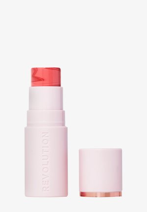 Crema blush stick Revolution in una base rosa con una parte superiore trasparente e spirale rossa e un cappuccio rosa abbinato con un accento dorato alla base.