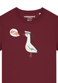 Burgunderfarbenes T-Shirt mit einem Grafikdesign eines Vogels in einem Matrosenhut, mit dem Text "MOIN!" in einer Sprechblase. Weicher Stoff, kurze Ärmel.