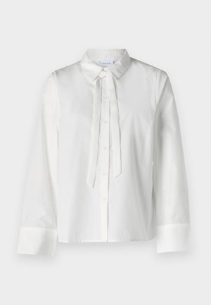 Weiße Bluse mit langen Ärmeln, Kragen, durchgehender Knopfleiste und Bindedetail am Ausschnitt. Glatte Stoffqualität und verkürztes Design.