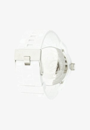 Weißes Silikon-Uhrenarmband mit Metallschnalle, geprägt mit Diesel-Logo und teilweise sichtbarem rundem Gehäuserücken der Uhr.