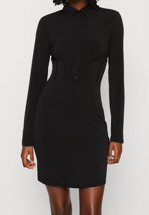 Black long-sleeve dress featuring a collared neckline, button front, fitted waist, and smooth texture that falls above the knee.