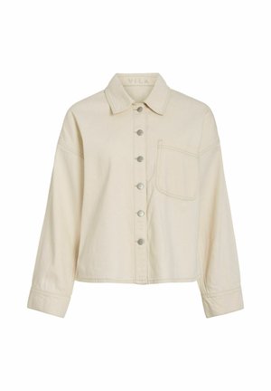 Chemise beige à manches longues avec col et poche poitrine, dotée de six boutons métalliques sur le devant.