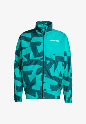 Teal ja tumesinine tuulejakk, millel on geomeetrilised mustrid, lukuga sulgemine, kõrge krae ja elastsed mansetid. Rinnal on TERREXi logo.