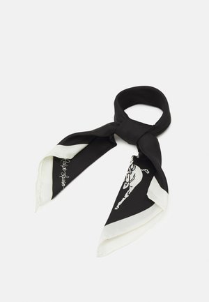 Zwart-witte zijden sjaal in een lus gestrikt, met een witte rand en gedeeltelijk grafisch ontwerp aan één uiteinde tegen een witte achtergrond.
