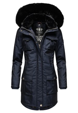 Navy blue parka with a faux fur-lined hood, zip front, and four outer pockets. Features quilted texture and contrasting interior pattern.