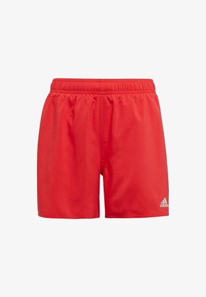 Red athletic shorts with an elastic waistband, made from lightweight material; features a small white logo on the lower right side.