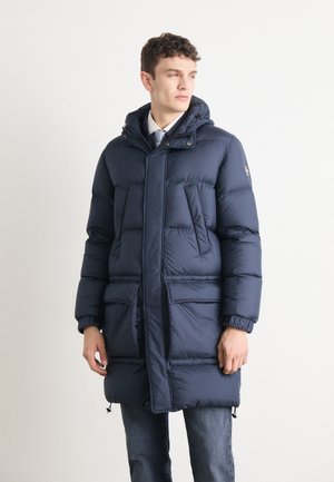 Navy blue padded parka with hood, featuring front zip closure, two large pockets, and ribbed cuffs. Textured fabric with horizontal seams.