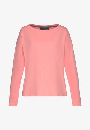 Long-sleeve t-shirt in coral pink, made of soft cotton fabric. Features a wide neck and dropped shoulders with cuffed sleeves.