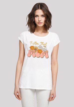 White cotton t-shirt featuring floral graphics and the phrase "I Am That Mum" in orange and pink. Relaxed fit with short sleeves.
