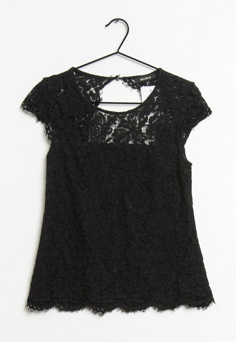 Haut noir en dentelle à manches courtes avec motif floral, col rond et ourlet festonné, suspendu sur un cintre noir sur fond blanc.