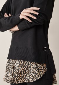Next Sweter