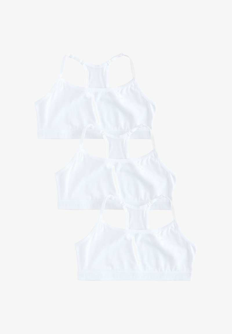 Trois brassières de sport blanches à dos nageur empilées verticalement sur un fond blanc, montrant la vue arrière et les bandes élastiques.
