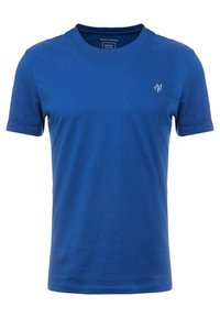 Camiseta de algodón azul con cuello redondo y mangas cortas. Presenta un pequeño logo en el lado izquierdo del pecho, textura suave y ajuste regular.