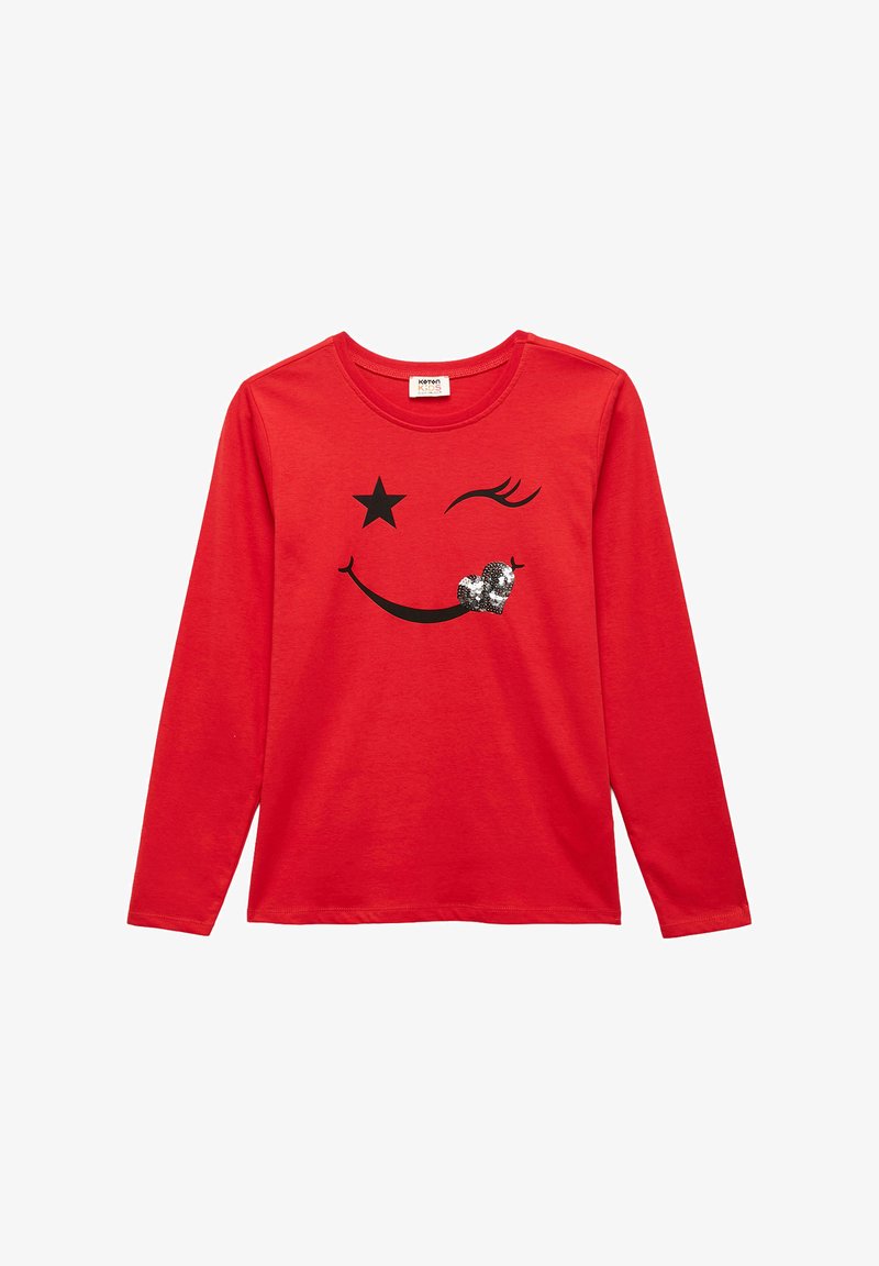 Red long-sleeve t-shirt featuring a black smiley face design with a star, an eye, and a sequined heart on the mouth area. Cotton material.