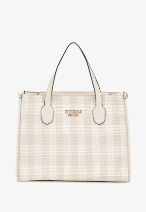 Beige and white checkered tote bag with dual handles and GUESS logo in gold lettering on front.