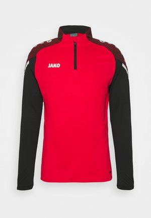 Rood en zwart sportshirt met lange mouwen en een kwart rits, met een structuurdesign op de schouders en het "JAKO"-logo op de borst.