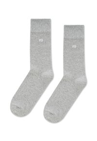 Szare bawełniane skarpetki z prążkowanymi mankietami i małym białym logo. Ich wygląd jest prosty, charakteryzuje się gładką teksturą i standardowym kształtem skarpet.