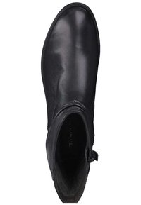 Svart läderankelboot med rund tå, slät yta, sidodragkedja och minimala sömdetaljer. Inre foder synligt.