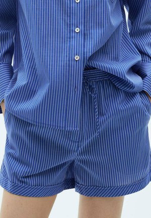 Blue and white striped pajama set featuring a button-up shirt with long sleeves and matching drawstring shorts, made of lightweight fabric.