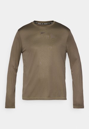 Cămașă cu mânecă lungă de culoare verde măsliniu, cu guler rotund, logo Reebok pe piept și bandă neagră contrastantă la guler. Textură netedă.