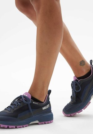 Men's Millet hiking shoes featuring a dark blue mesh upper, purple accents, reinforced toe cap, and textured sole for traction.