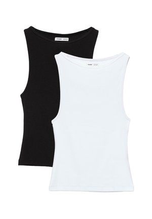 Deux débardeurs sans manches côtelés, un noir et un blanc, posés à plat avec le débardeur blanc recouvrant le noir.