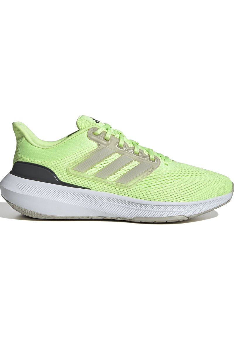 Zapatilla de correr verde claro con parte superior de malla, tres franjas transparentes, cuello acolchado y un acento gris en el talón. Suela blanca con patrón texturizado.