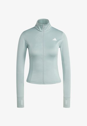 Chaqueta ajustada azul claro con cremallera, mangas largas, agujeros para los pulgares y un pequeño logo blanco en el pecho izquierdo.