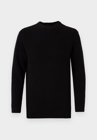 Pull noir en tricot côtelé avec des manches longues, un col rond et un ourlet droit. La texture est lisse et légèrement extensible.