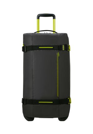 Black duffel bag with a retractable handle, yellow accents, and nylon fabric. Features side zipper pocket and adjustable straps.