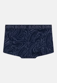 Marinblå kalsonger med ett abstrakt vågmönster i en mörkare nyans, med en bred midja präglad med "BJÖRN BORG." Mjuk tygkvalitet.