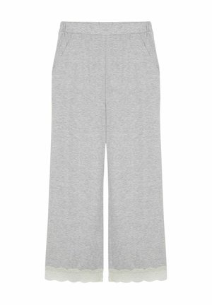 Szare szerokie spodnie dresowe z miękkiego materiału, z kieszeniami po bokach i falbanami z koronką na dole. Casualny i wygodny design.