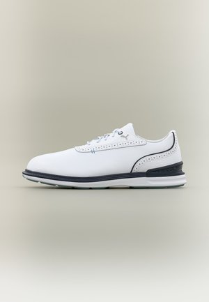 White leather sneaker with black sole trim, perforated detailing, lace-up front, and subtle Puma logo on side, shown in profile on neutral background.
