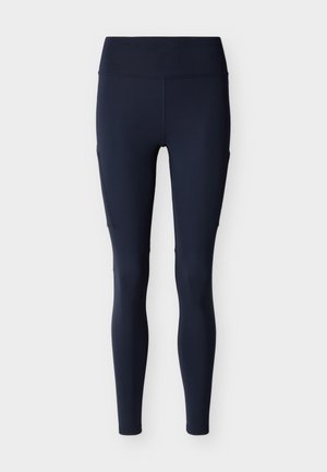 Leggings bleu marine taille haute, longueur entière, avec poches latérales, conçus pour le sport et les mouvements actifs.