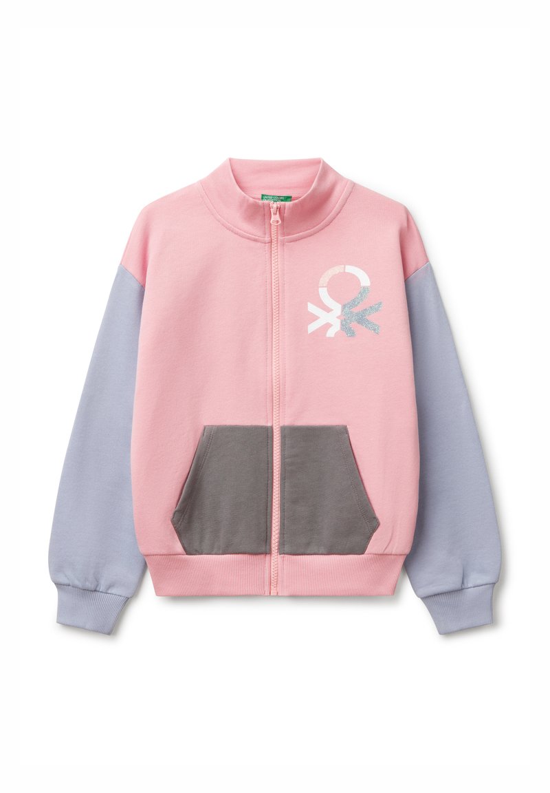 Light pink zip-up jacket with gray and light blue sleeves, featuring a front pocket and a decorative metallic symbol on the chest.