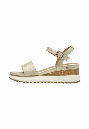 Beige wedge sandal with textured wide front strap, adjustable ankle strap with buckle, cork midsole, and white ridged outsole.