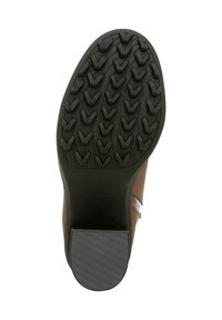 Semelle de chaussure marron avec caoutchouc noir texturé, arborant un motif de bande de zigzag. Marquage Vionic près du talon. Bord plat et légèrement contourné.