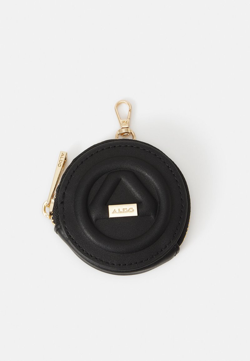 Porte-monnaie rond noir en cuir, avec un motif géométrique en relief, quincaillerie dorée et un clip pour attacher. Fermeture zippée.