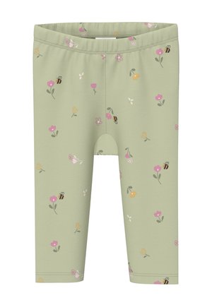 Jasnozielone legginsy z kolorowym wzorem kwiatów i pszczół rozmieszczonym na tkaninie.