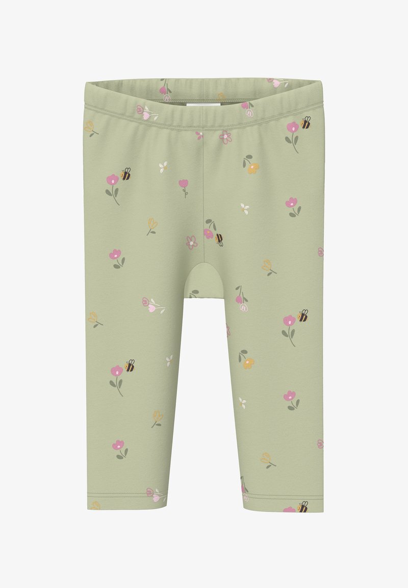 Leggings vert clair avec un motif coloré de fleurs et d'abeilles dispersé sur le tissu.