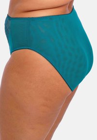 Culotte taille haute en teal fabriquée en matériau lisse et transparent avec des accents en dentelle florale sur les côtés et un délicat bord festonné.