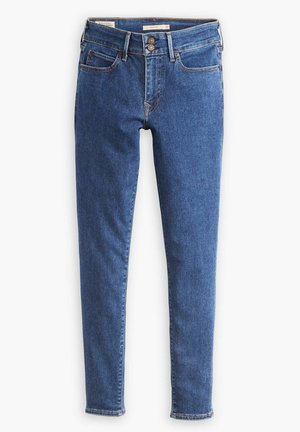 Jeans en denim bleu skinny-fit avec une taille mi-haute, poches avant et coutures dorées. Comprend une fermeture à deux boutons et un léger délavage.