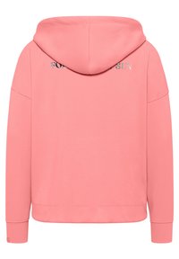 Roze hoodie met een trekkoordkap, relaxte pasvorm en de tekst "FOR THE SUN" geborduurd op de achterkant. Zacht materiaal met ribgebreide manchetten.