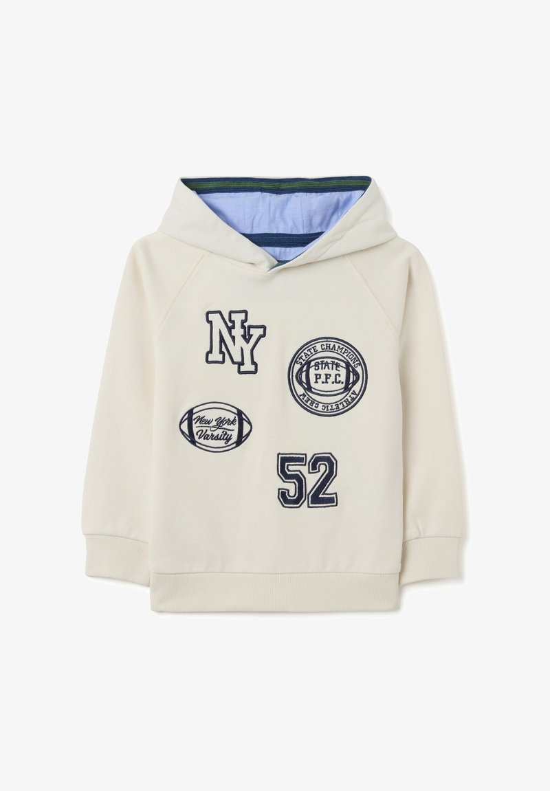 Hooded sweatshirt in off-white with navy embroidered patches, including "NY," "52," and sport-related designs. Soft fabric with ribbed cuffs.