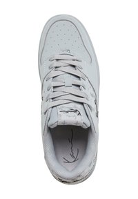 Light gray sneaker made of smooth leather with perforated toe, tonal laces, printed accents on tongue and side, and textured interior.