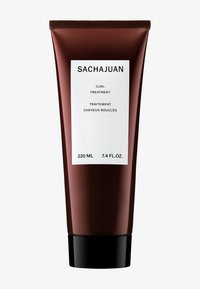 Tubetto di trattamento per capelli ricci Sachajuan, 220 ml, di colore marrone scuro, finitura opaca, e etichetta bianca con testo in nero e grigio.